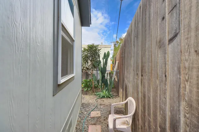 a view of a house with backyard and porch