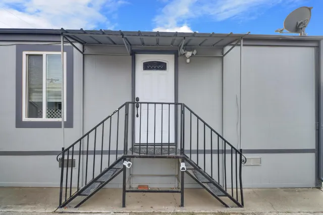 a view of a balcony with staircase