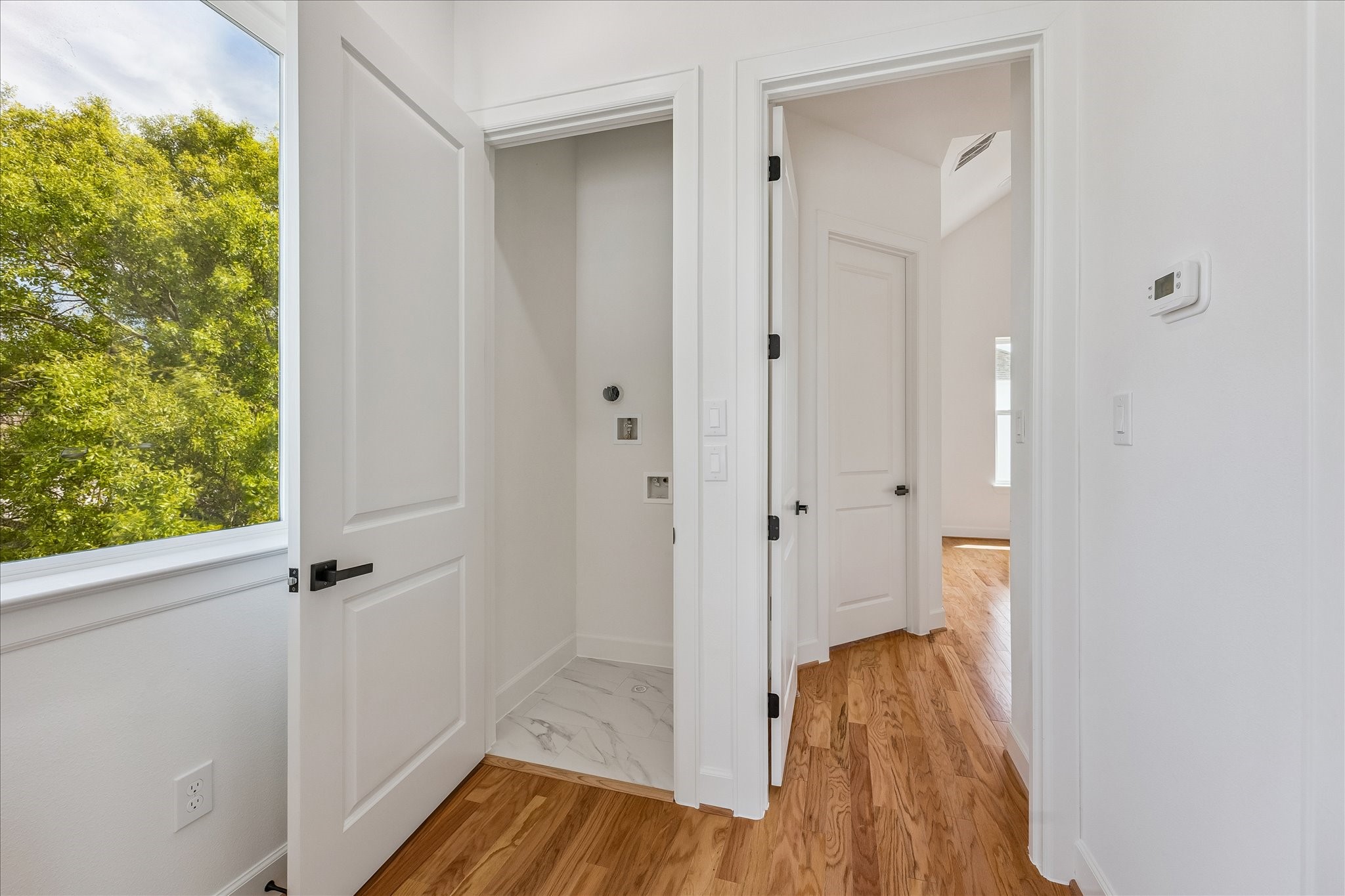 9426 Campbell Road, Unit A Houston, TX 77080 - Photo 13 of 17 a view of a hallway with wooden floor and closet area