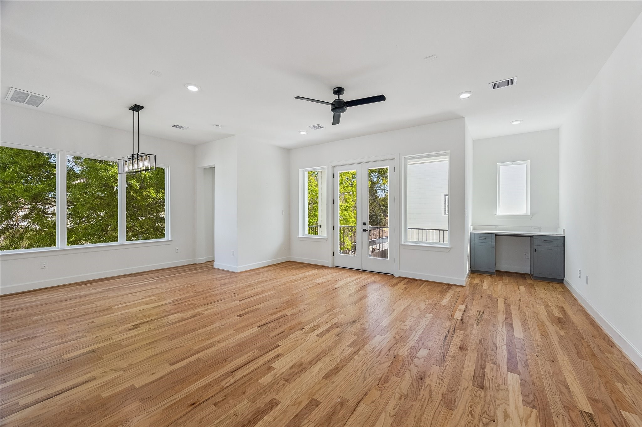 9426 Campbell Road, Unit A Houston, TX 77080 - Photo 17 of 17 an empty room with wooden floor and windows