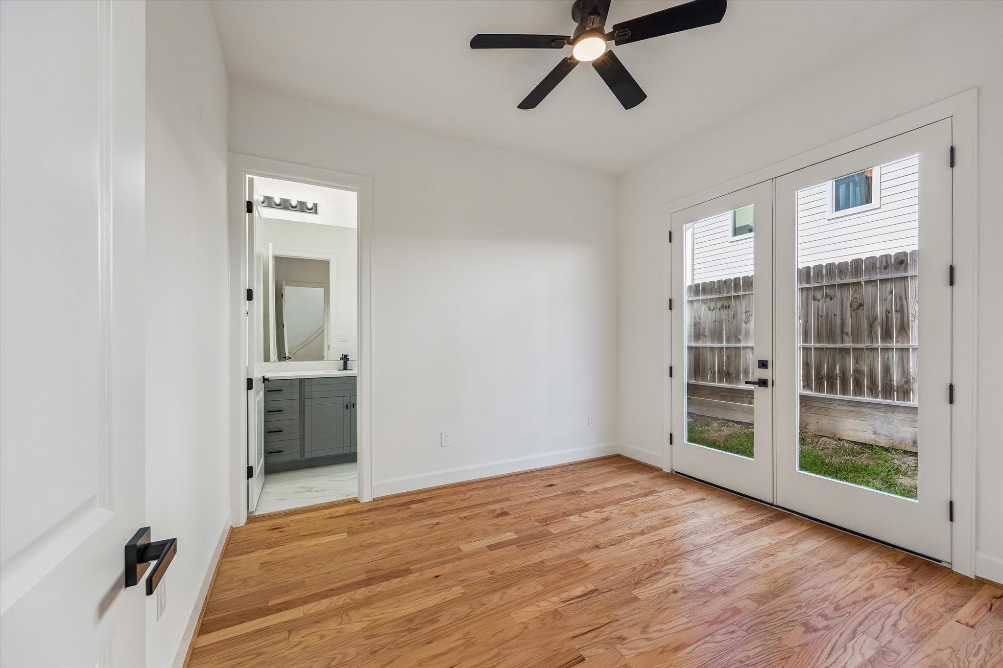 9426 Campbell Road, Unit A Houston, TX 77080 - Photo 3 of 17 a view of a room with wooden floor and windows