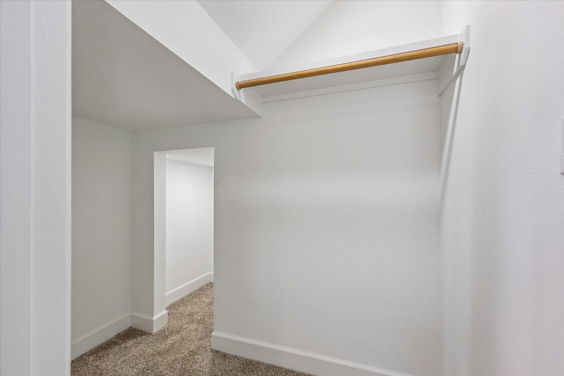 9426 Campbell Road, Unit A Houston, TX 77080 - Photo 5 of 17 Spacious secondary bedroom closet featuring an additional interior closet, offering enhanced storage and organization. This thoughtfully designed layout provides the benefit of separating seasonal items, maximizing space, and keeping belongings neatly tucked away for a clean, clutter-free feel.