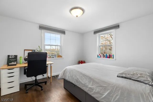 a bedroom with a workspace