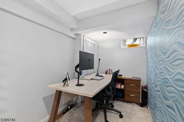 a view of a workspace with furniture