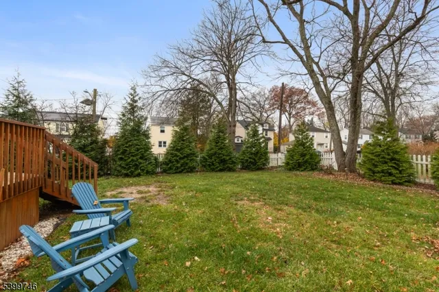a view of backyard with trampoline