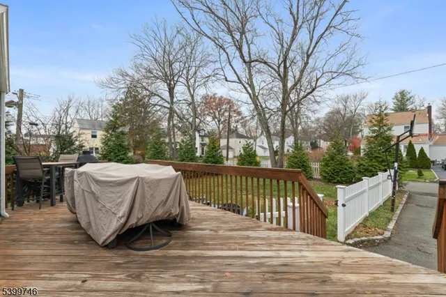 a view of a white house on the side of the road