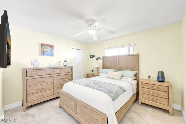 a bedroom with a bed and a dresser