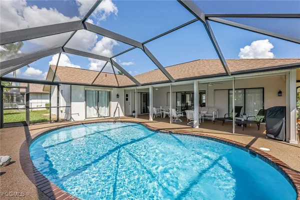 a view of a swimming pool with a patio
