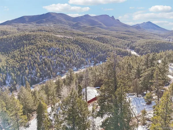 a view of mountains and valleys