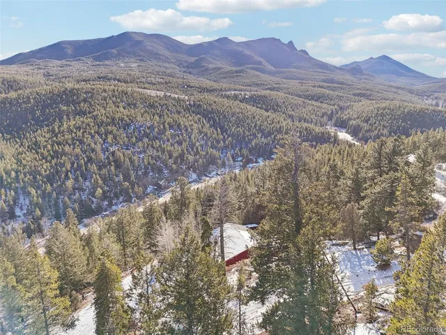 a view of mountains and valleys