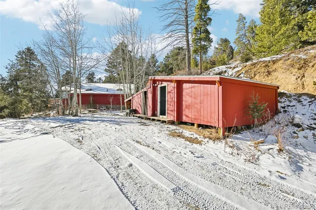 a view of a house with a snow in the yard