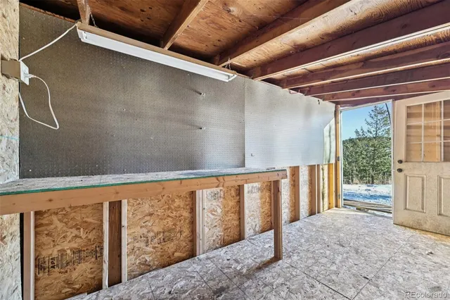 a picture of a bench in front of a wall