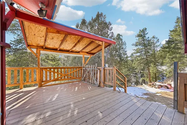 a view of a balcony with wooden floor