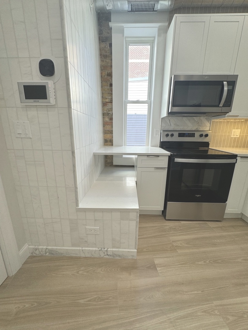 601 Green Bay Road, Unit 204 Wilmette, IL 60091 - Photo 15 of 19 a view of kitchen and sink
