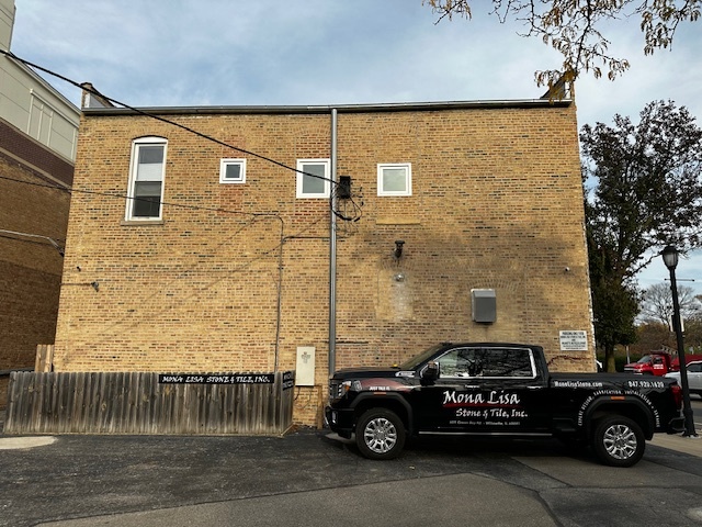 601 Green Bay Road, Unit 204 Wilmette, IL 60091 - Photo 19 of 19 a car parked in front of a brick house