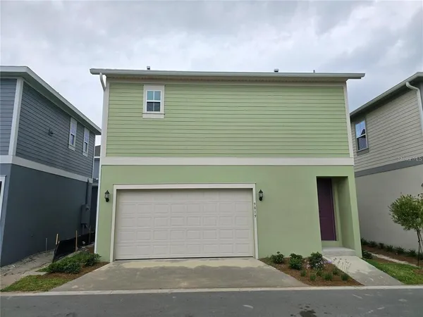 a front view of a house with garage