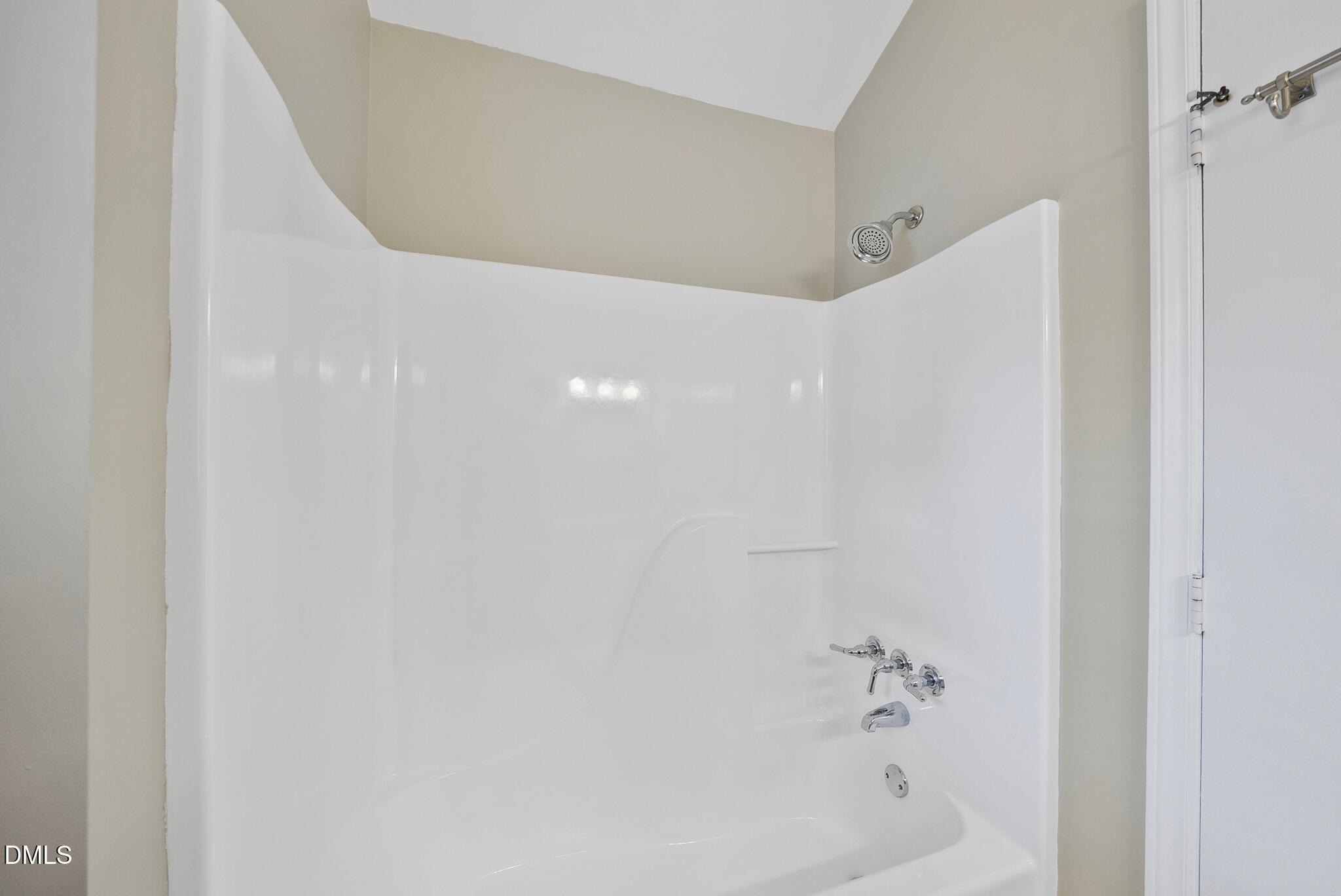 3634 Mill Run Raleigh, NC 27612 - Photo 16 of 18 a bathroom with a bathtub