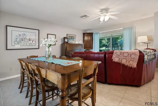 a living room with dining table