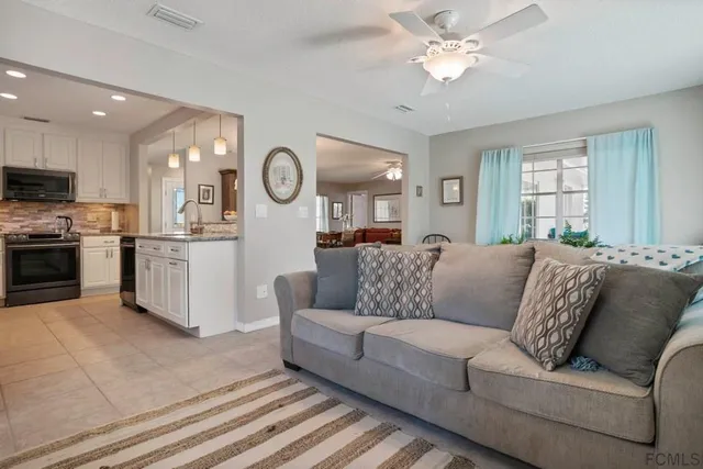 a kitchen with a sink stove and refrigerator
