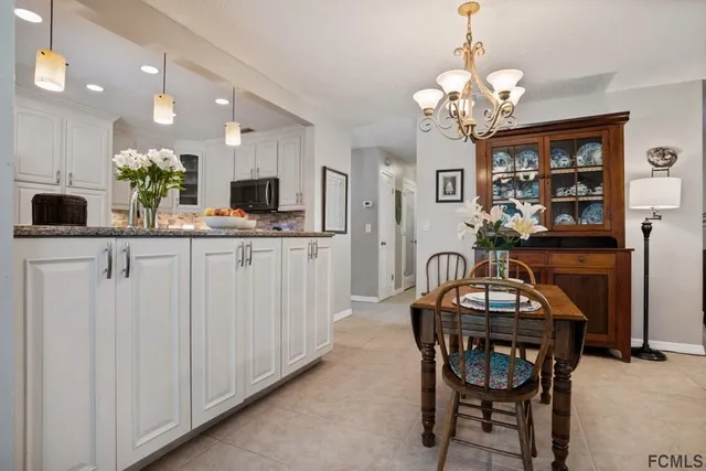 a bedroom with a bed and a table