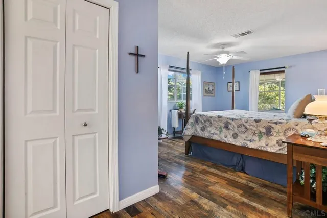 a bedroom with a bed and a lamp