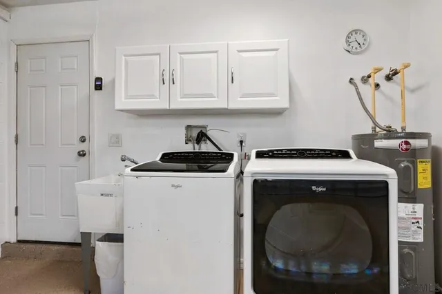 a view of a house with backyard porch and sitting area