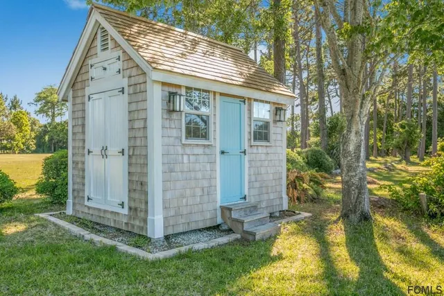 a view of a chair and table in patio with a table and chairs