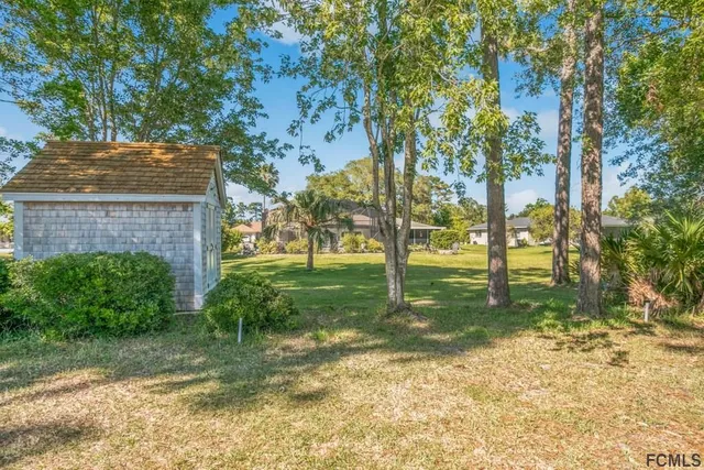 an aerial view of residential house with outdoor space and swimming pool
