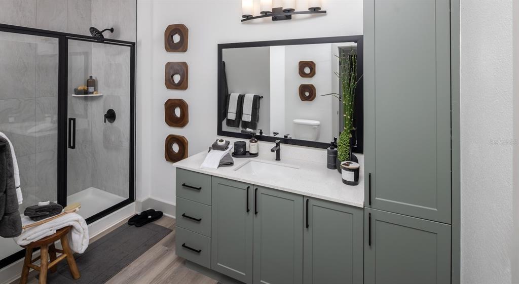 5000 Collina Terrace, Unit TH1 Clermont, FL 34711 - Photo 27 of 28 a bathroom with a sink mirror and shower