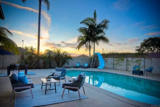 a view of a chairs and table in patio