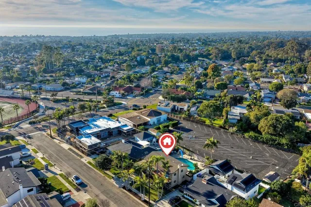 an aerial view of residential houses with outdoor space