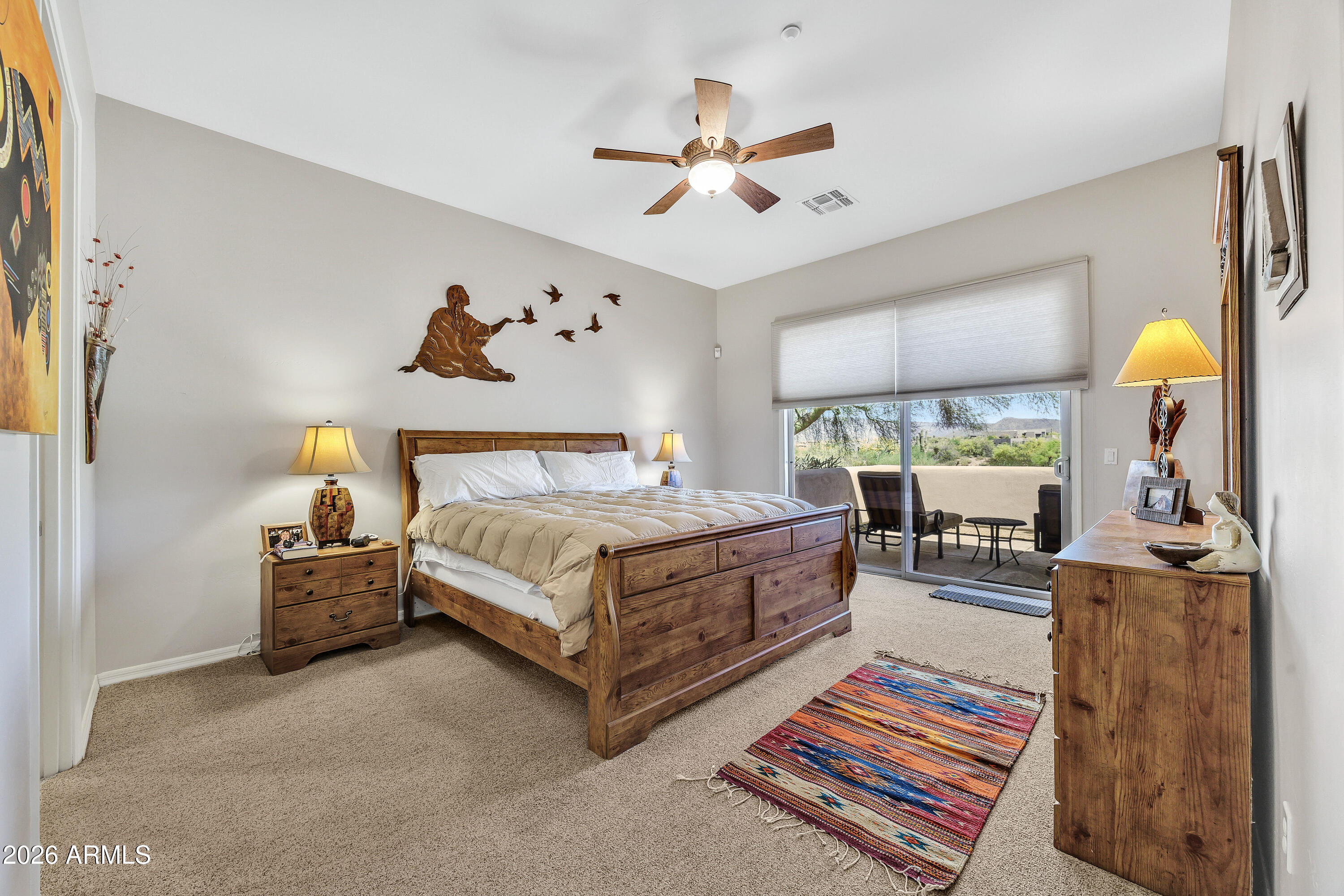 7402 Hum Road, Unit 19 Carefree, AZ 85377 - Photo 11 of 25 a bedroom with a bed and a chandelier