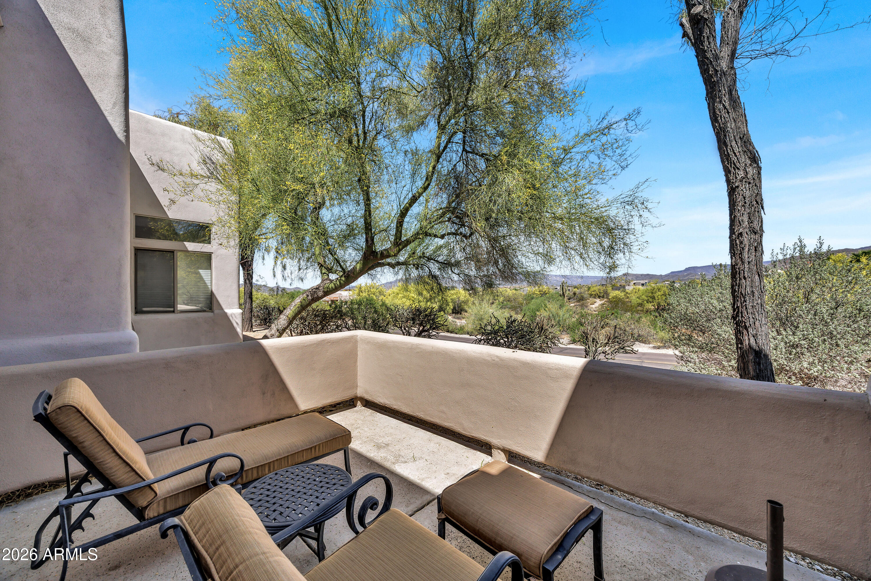 7402 Hum Road, Unit 19 Carefree, AZ 85377 - Photo 13 of 25 a view of balcony with couch