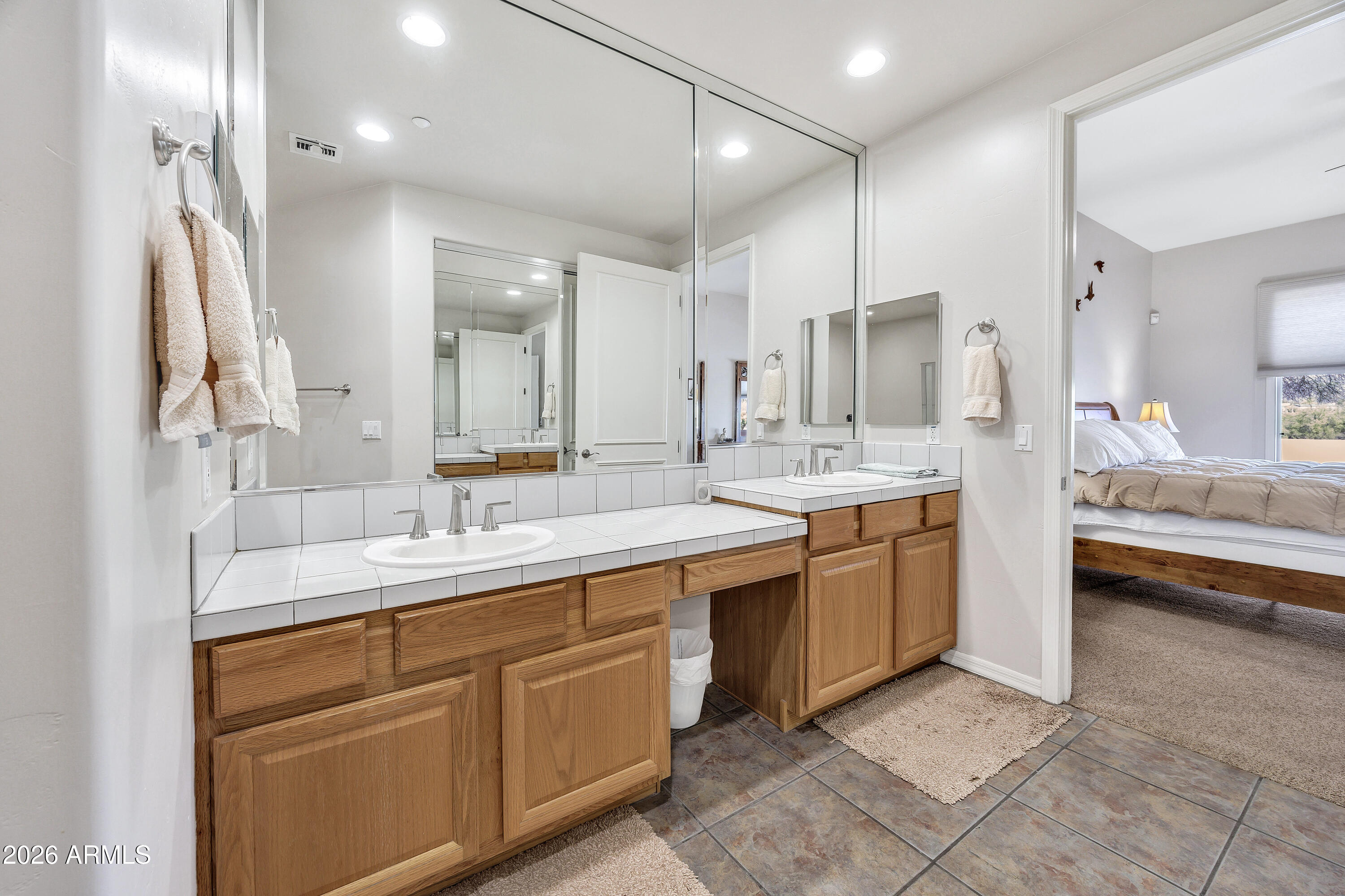 7402 Hum Road, Unit 19 Carefree, AZ 85377 - Photo 15 of 25 a large bathroom with a double vanity sink a mirror and a shower