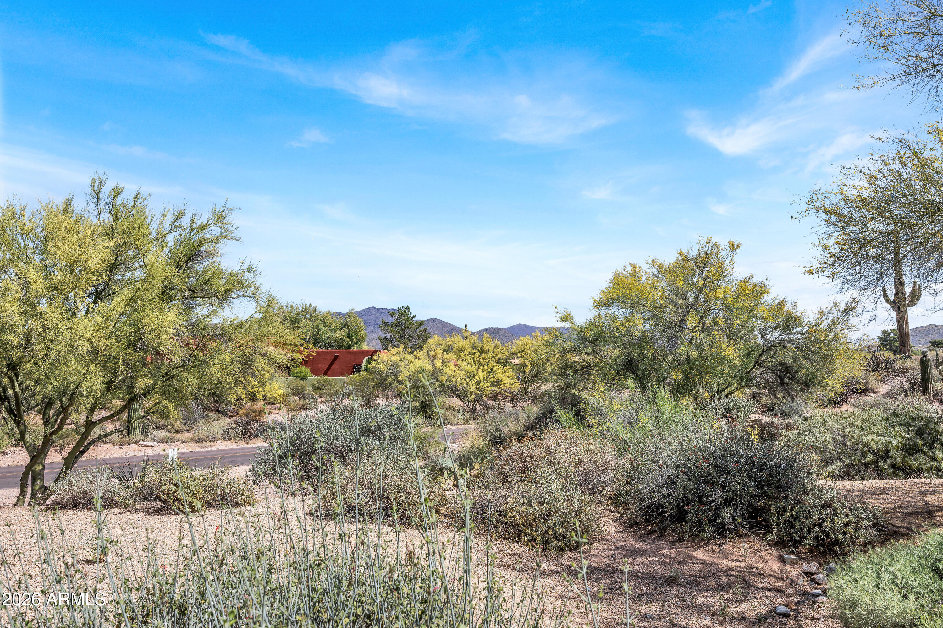 7402 Hum Road, Unit 19 Carefree, AZ 85377 - Photo 18 of 25 a view of a large building with a mountain in the background