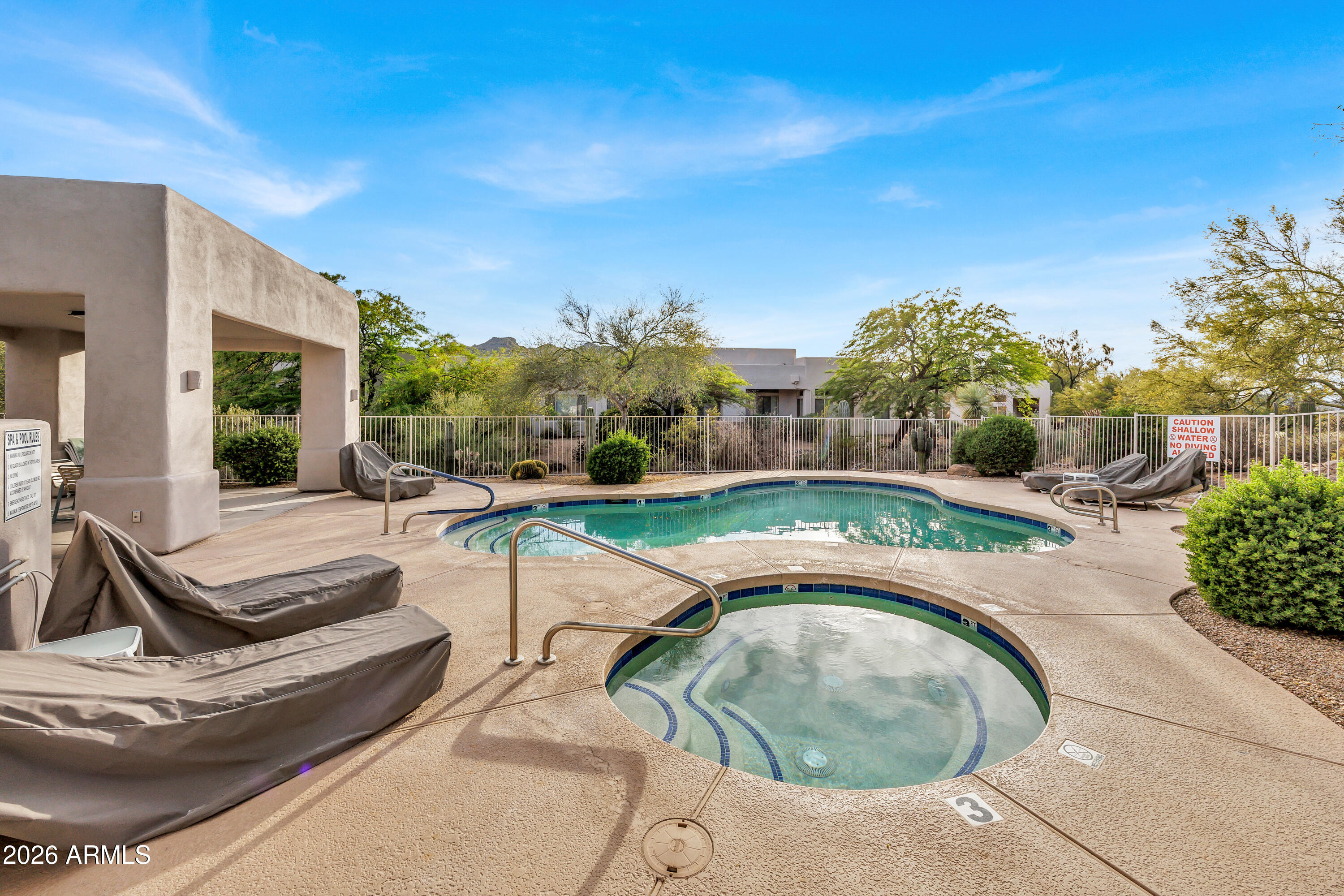 7402 Hum Road, Unit 19 Carefree, AZ 85377 - Photo 21 of 25 a view of a swimming pool with a patio