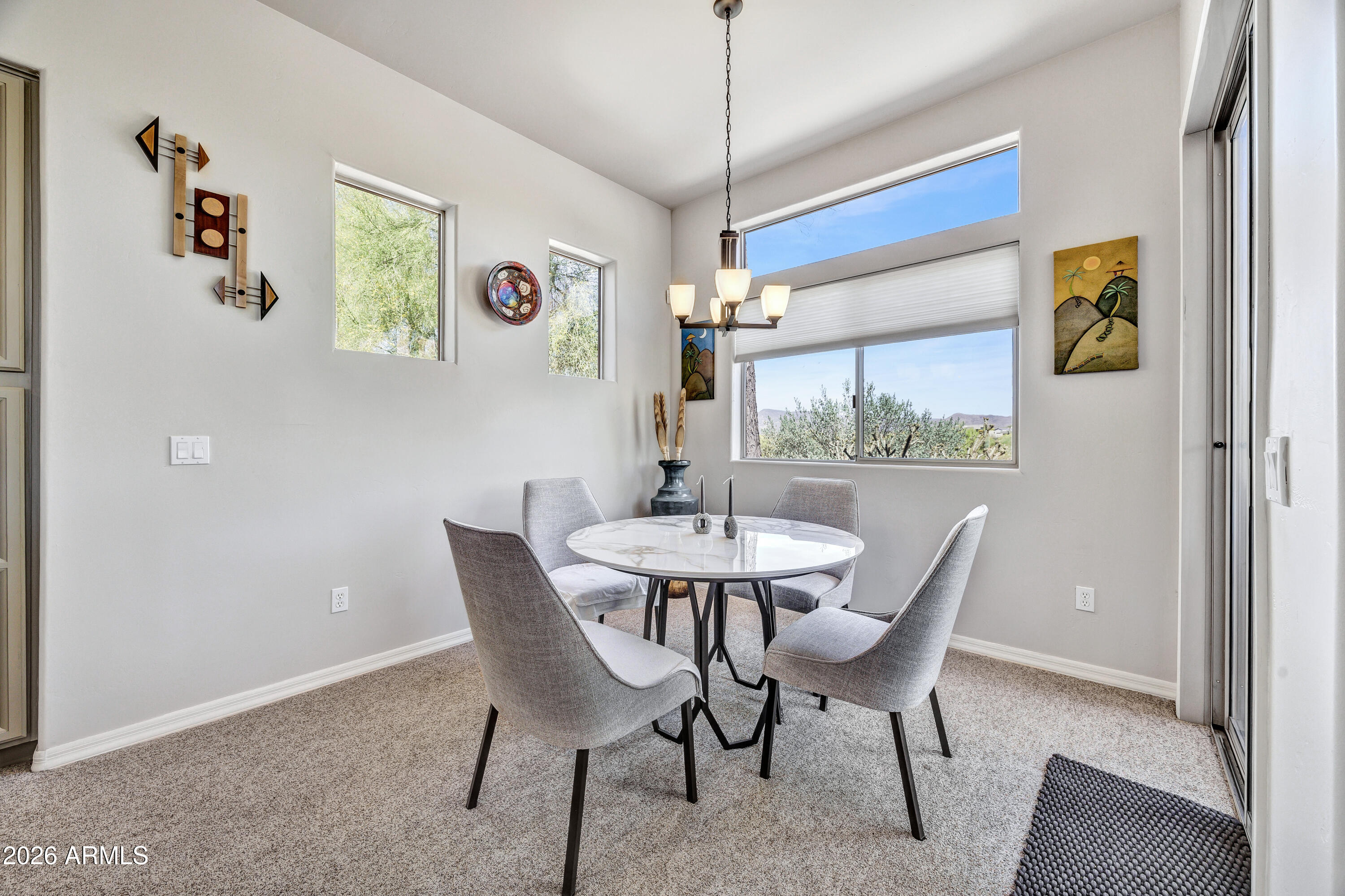 7402 Hum Road, Unit 19 Carefree, AZ 85377 - Photo 9 of 25 a dining room with furniture and window