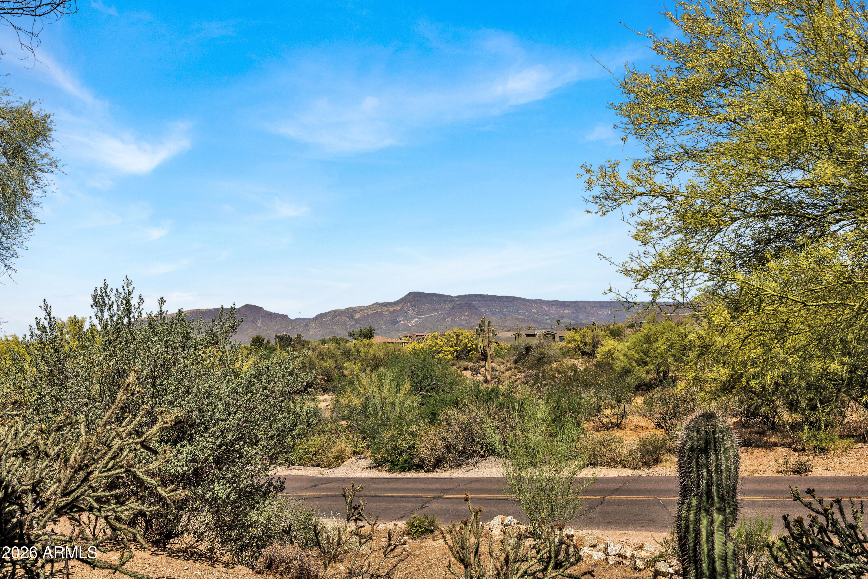7402 Hum Road, Unit 19 Carefree, AZ 85377 - Photo 10 of 25 a view of a lake with a mountain in the background