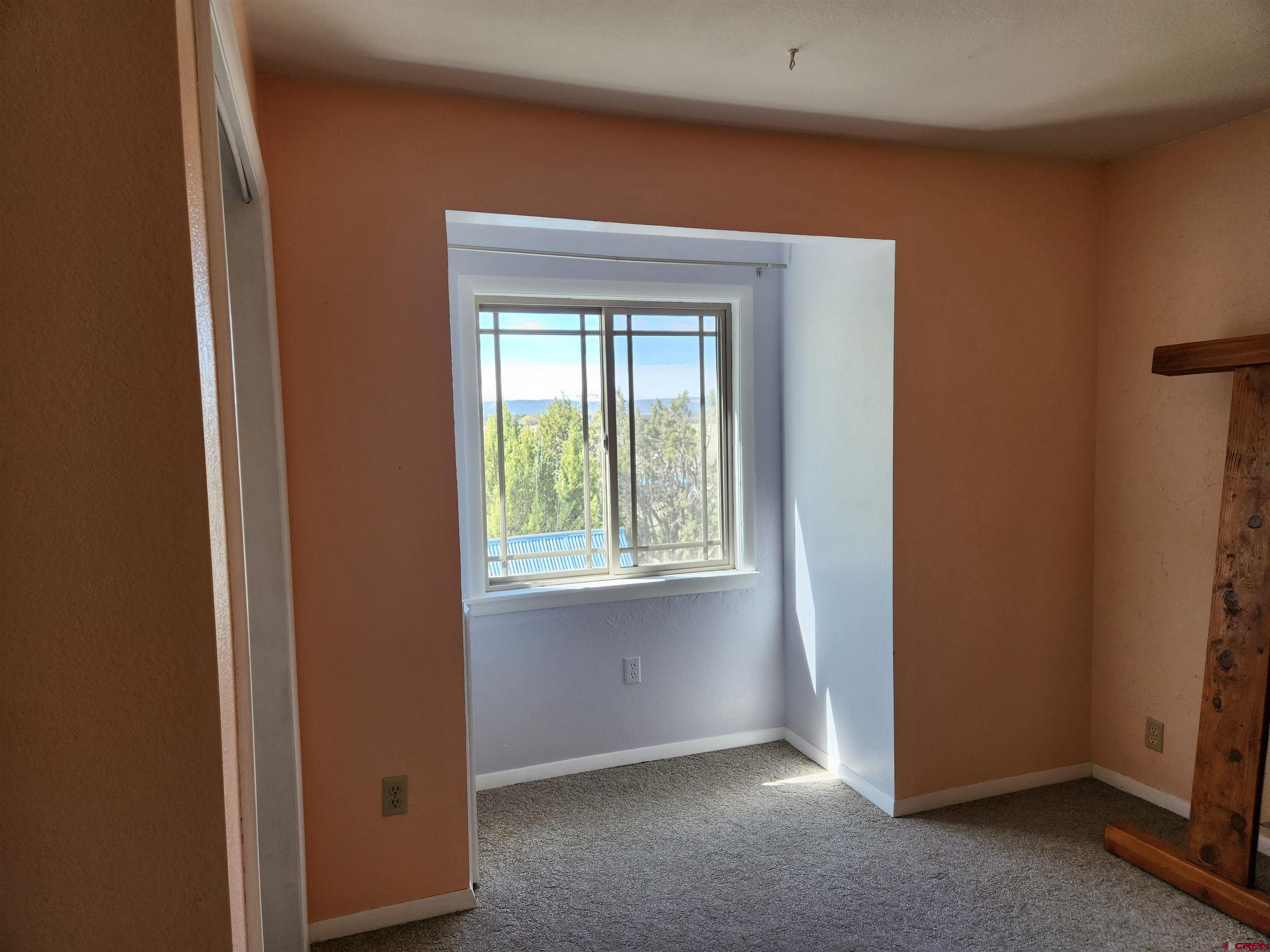 8654 Highway 172 Ignacio, CO 81137 - Photo 15 of 35 a view of an empty room and window