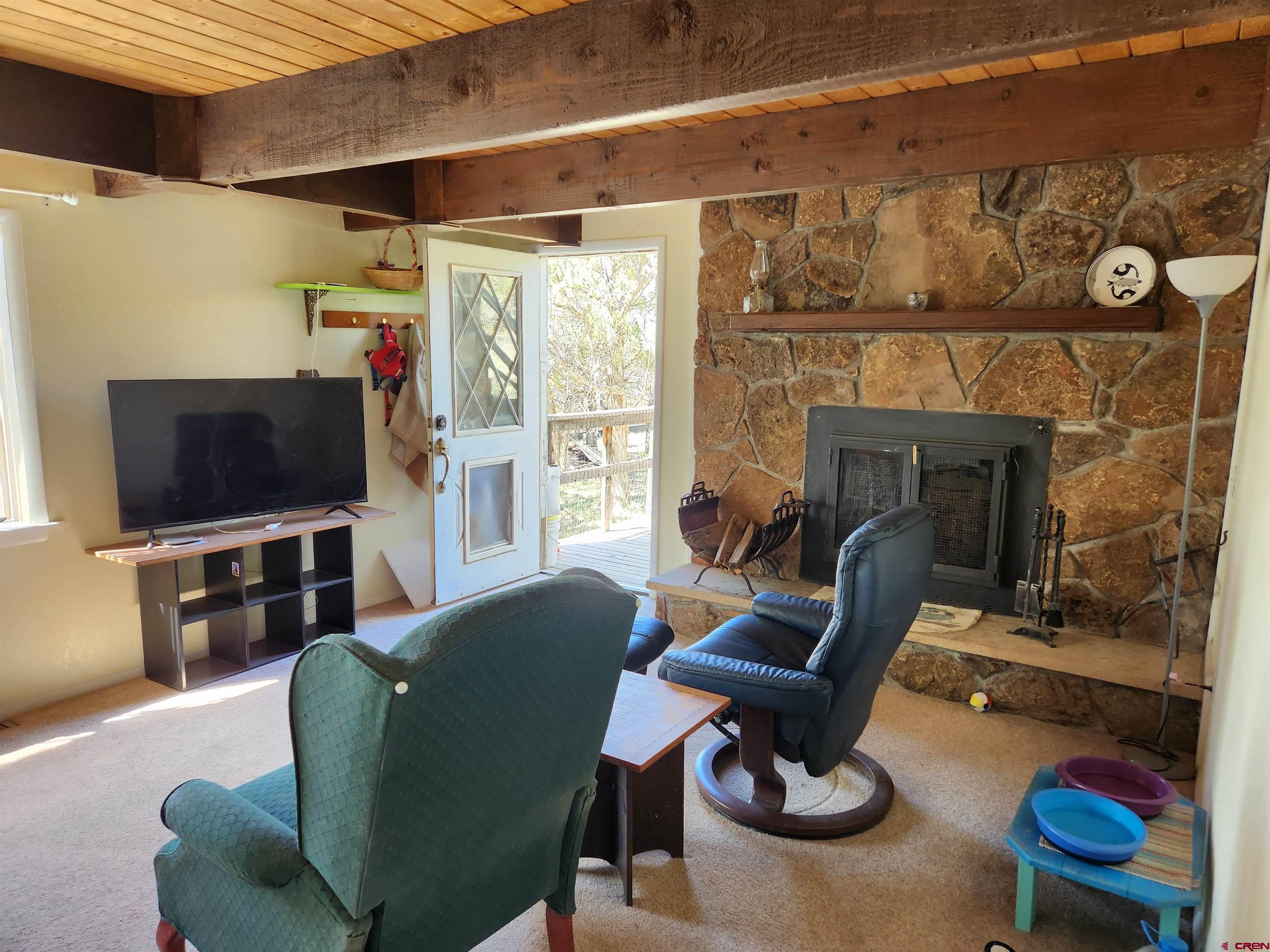 8654 Highway 172 Ignacio, CO 81137 - Photo 21 of 35 a living room with furniture and a flat screen tv