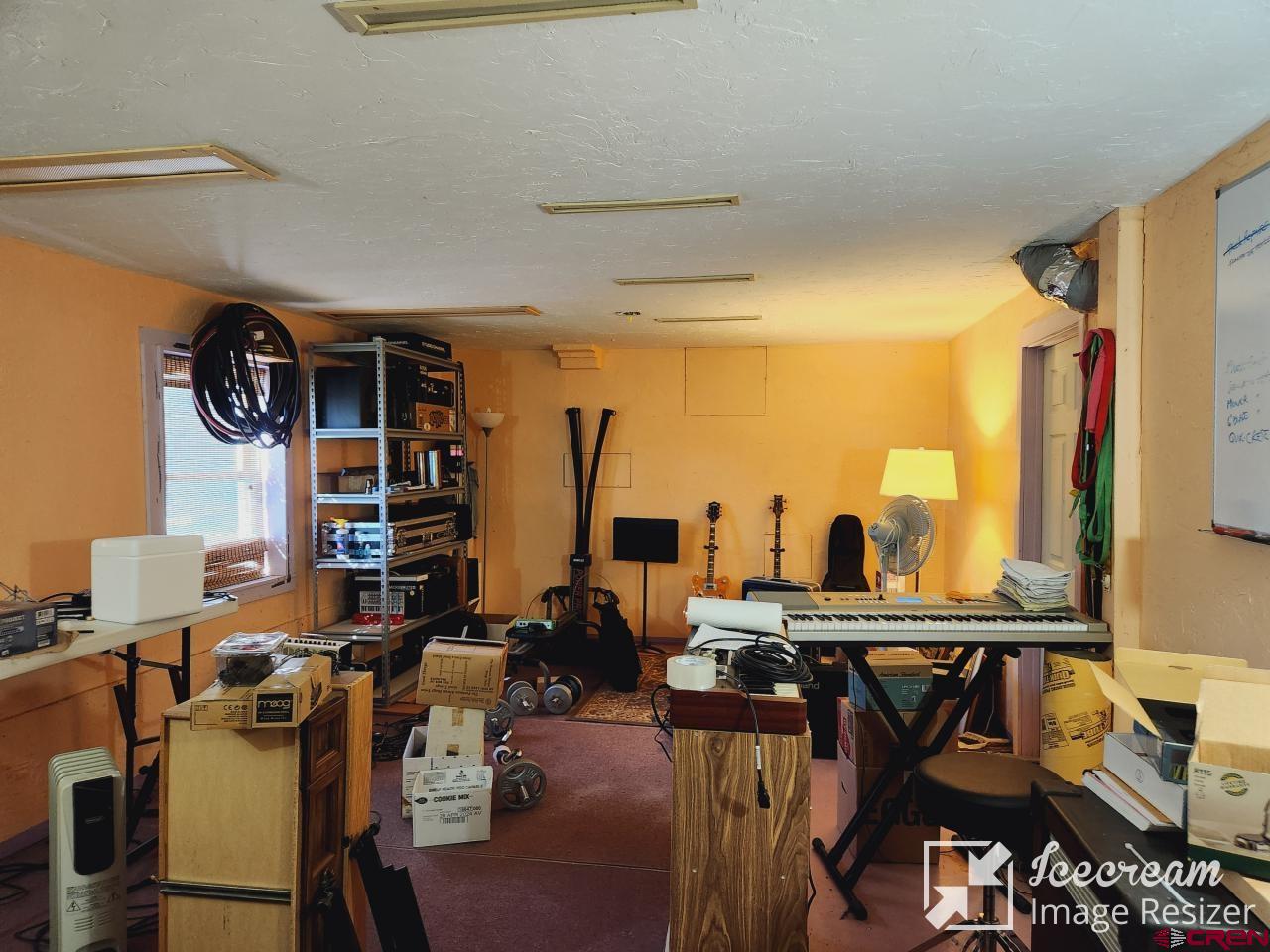 8654 Highway 172 Ignacio, CO 81137 - Photo 22 of 35 a view of a dining room with furniture and chandelier