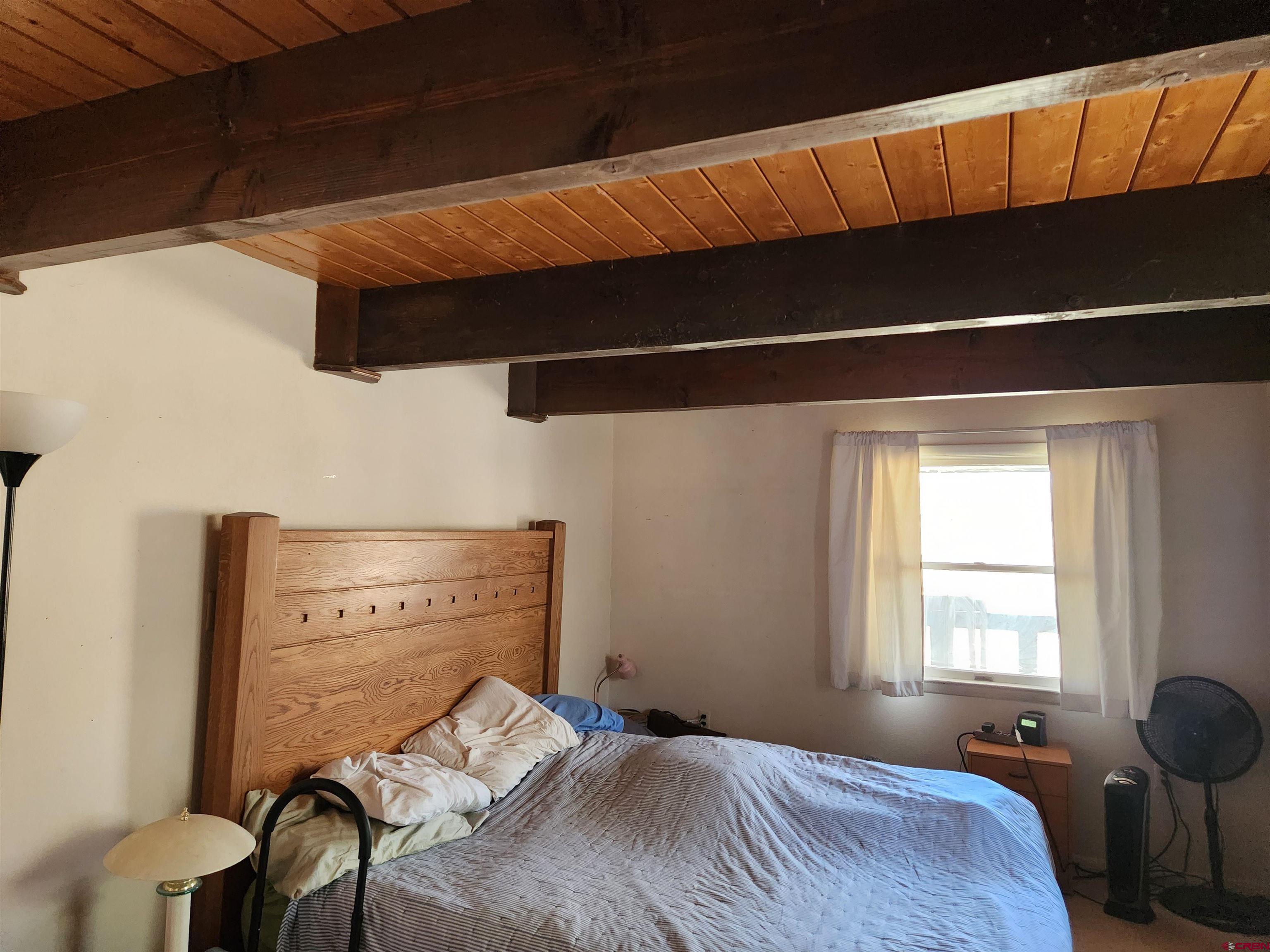 8654 Highway 172 Ignacio, CO 81137 - Photo 23 of 35 a bedroom with a bed and a window