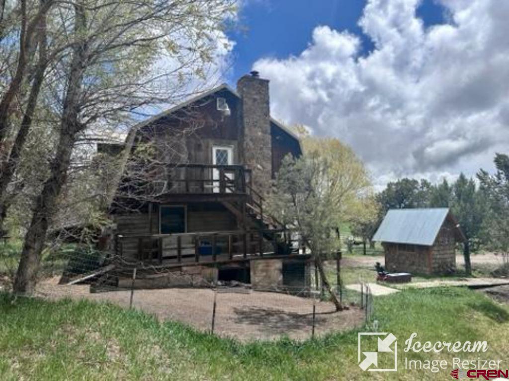 8654 Highway 172 Ignacio, CO 81137 - Photo 3 of 35 a front view of a house with garden