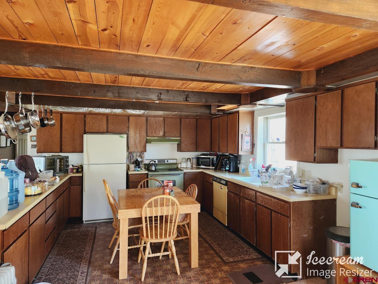 8654 Highway 172 Ignacio, CO 81137 - Photo 8 of 35 a kitchen with a sink a counter space appliances and cabinets