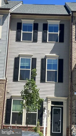a view of a house with a window and balcony