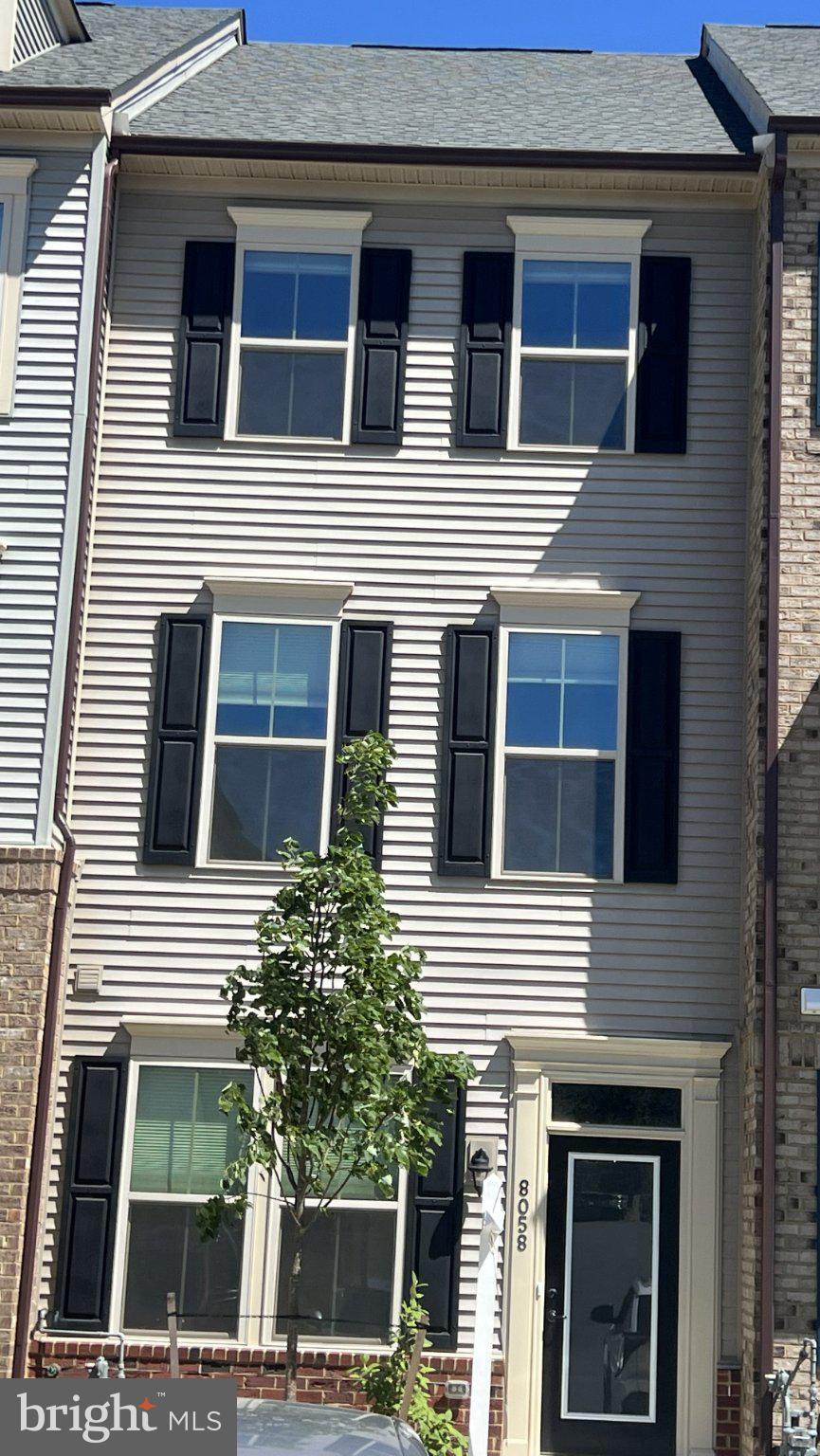 8058 Big Roundtop Road Fort George G Meade, MD 20755 - Photo 1 of 24 a view of a house with a window and balcony