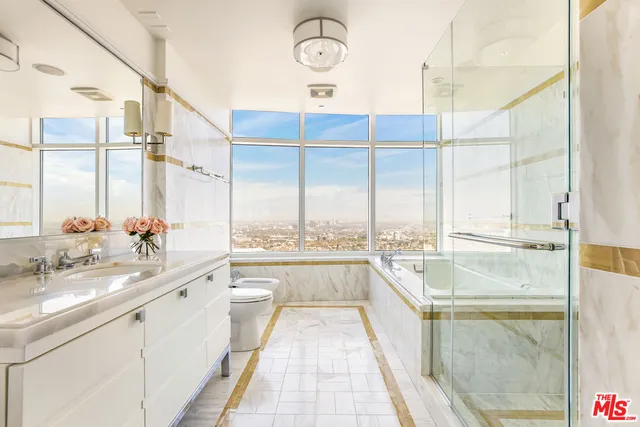 a large white kitchen with a large window