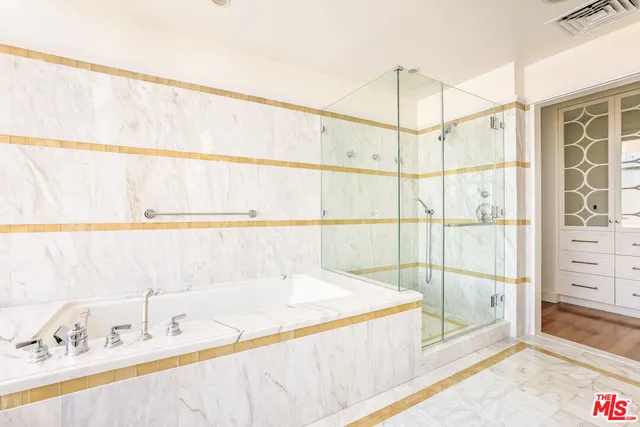 a bathroom with a tub and a sink