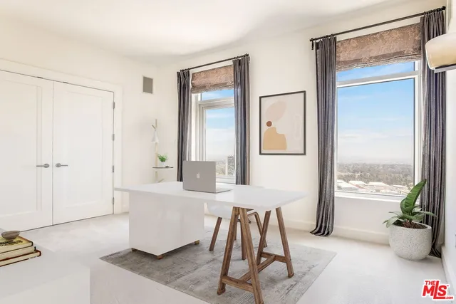 a living room with a couch and a table