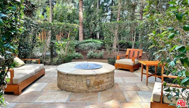 a view of a backyard with sitting area